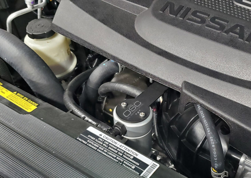 J&amp;L 16-23 Nissan Titan 5.6L Passenger Side Oil Separator 3.0 - Clear Anodized